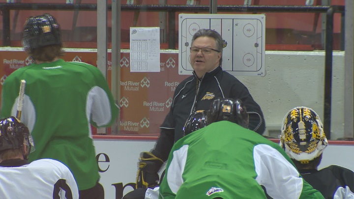 Brandon Wheat Kings head coach Kelly McCrimmon talks with his team at practice in Brandon.