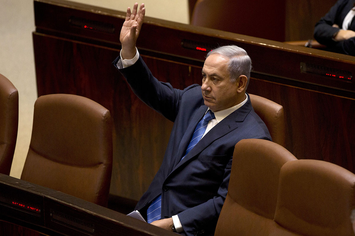 Israeli Prime Minister Benjamin Netanyahu, gestures as he sits at the Knesset, Israel's parliament in Jerusalem, Monday, May 23, 2016.
