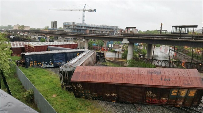 Several cars remain overturned after a CSX freight train derailed in Washington on Sunday, May 1, 2016. 