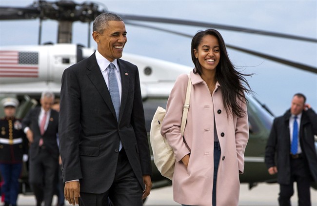 In a Thursday, April 7, 2016 file photo, President Barack Obama jokes with his daughter Malia Obama as they walk to board Air Force One from the Marine One helicopter, as they leave Chicago en route to Los Angeles. The White House announced Sunday, May 1, 2016, that Malia .