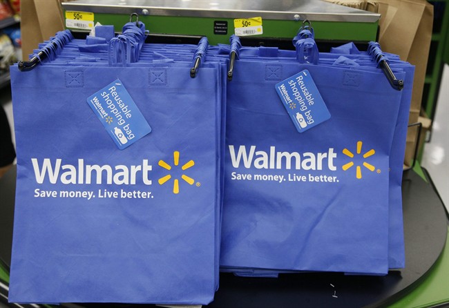 FILE - In this Thursday, Sept. 19, 2013, file photo, reusable shopping bags are offered for sale at a Wal-Mart Neighborhood Market, in the Chinatown district of Los Angeles.  