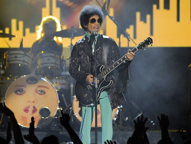 In this May 19, 2013 file photo, Prince performs at the Billboard Music Awards at the MGM Grand Garden Arena in Las Vegas.