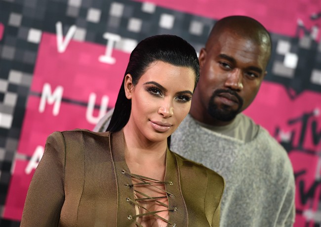 Kim Kardashian, left, and Kanye West arrive at the MTV Video Music Awards at the Microsoft Theater in Los Angeles.
