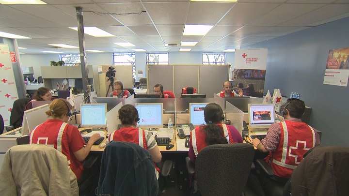 Volunteers are busy accepting donations for victims for the Fort McMurray fires at a Red Cross emergency call center in Montreal.