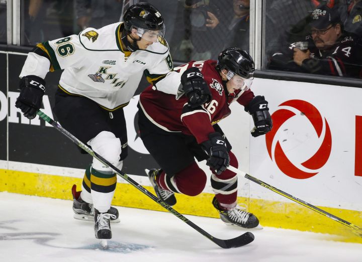 London Knights' Chris Martenet, right, chses down Red Deer Rebels' Grayson Pawlenchuk during third period CHL Memorial Cup hockey action in Red Deer, Friday, May 20, 2016.