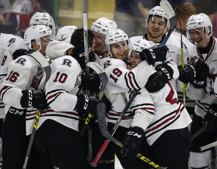 Red Deer Rebels' celebrate their win over the Brandon Wheat Kings following overtime CHL Memorial Cup hockey action in Red Deer, Wednesday, May 25, 2016.