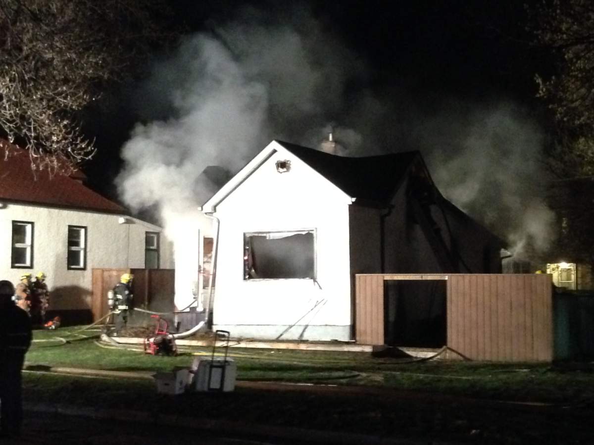 Smoke still billowing from house at 5 a.m. Wednesday.