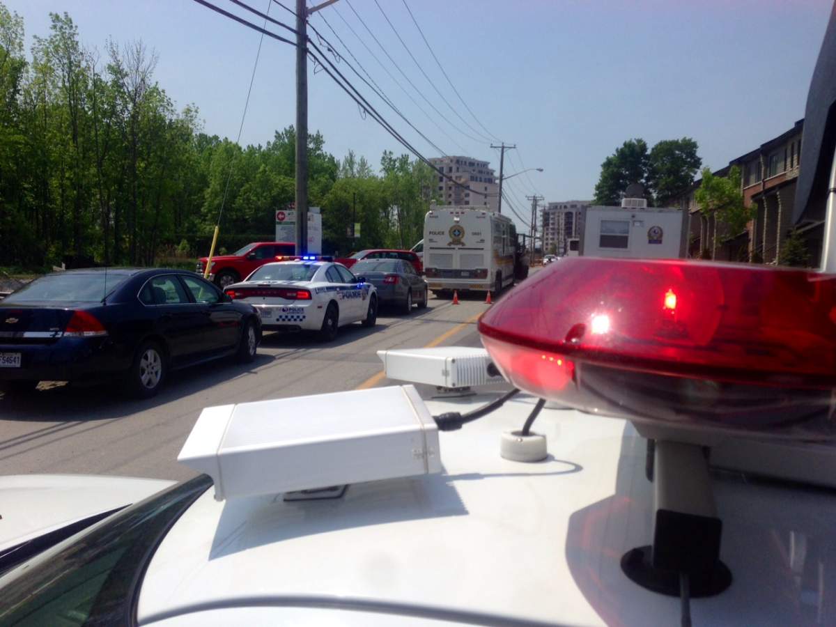 Officers investigate the fatal shooting of presumed head of Montreal’s Italian mafia, Rocco Sollecito, Friday, May 27, 2016.