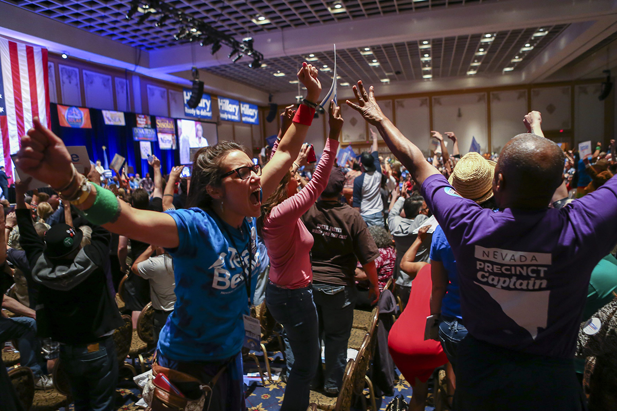 In a Saturday, May 14, 2016 photo, supporters of Democratic presidential candidate Bernie Sanders react during the Nevada State Democratic Party’s 2016 State Convention at the Paris hotel-casino in Las Vegas.
