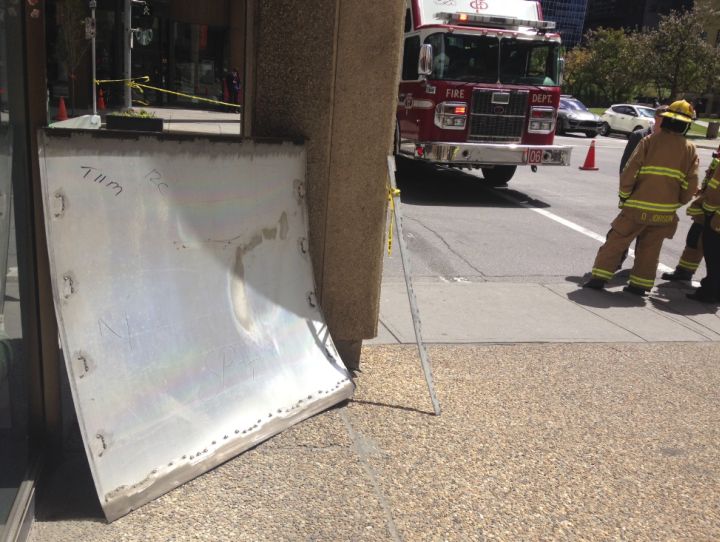 A large metal sheet fell from a building near the courthouse Monday. Roads were blocked off after the incident.