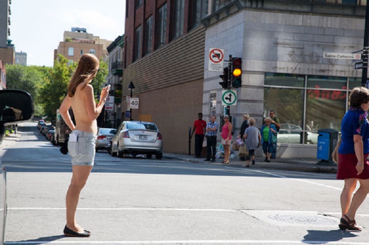 Journalist Lili Boisvert walked around downtown Montreal topless to see what people would do and say, 2014.