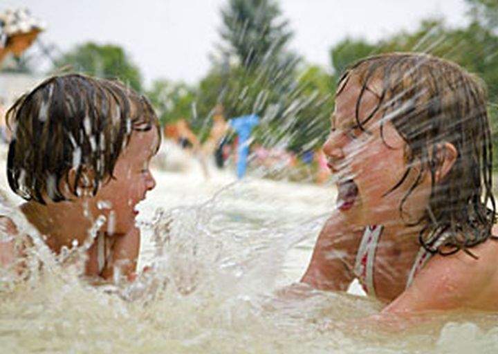 Some city spray parks have opened early on weekends this year.
