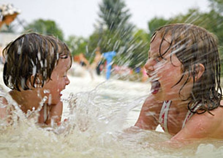 Some city spray parks have opened early on weekends this year.
