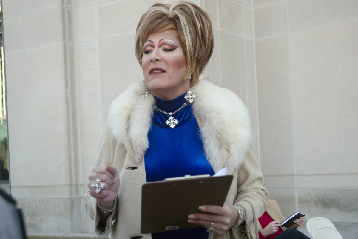 In this photo taken Jan. 12, 2016, Ambrosia Starling speaks to a crowd during a rally against Alabama Chief Justice Roy Moore outside the Alabama Supreme Court building in Montgomery, Ala.   