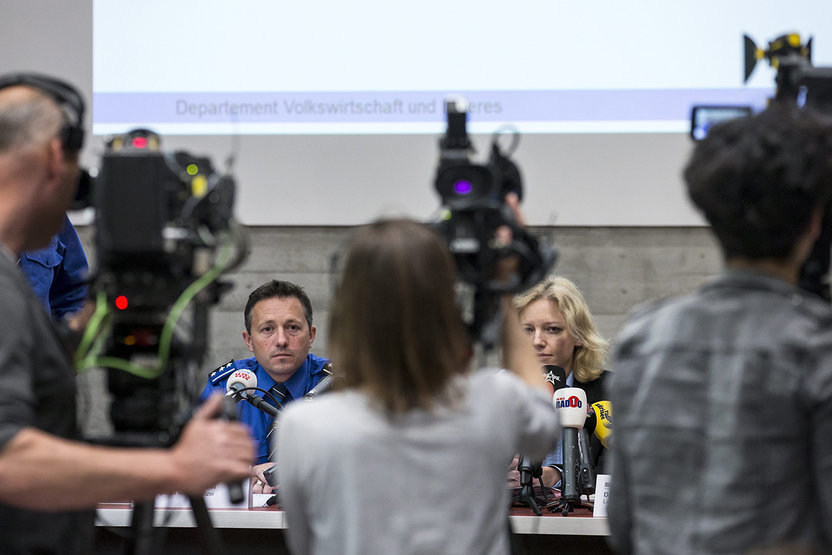 In this Friday May 13, 2016 picture Police captain  Markus Gisin, left, and prosecutor Barbara Loppacher, right inform  the media in Schafisheim, Switzerland. about the killing of a family in Rupperswil in December. 