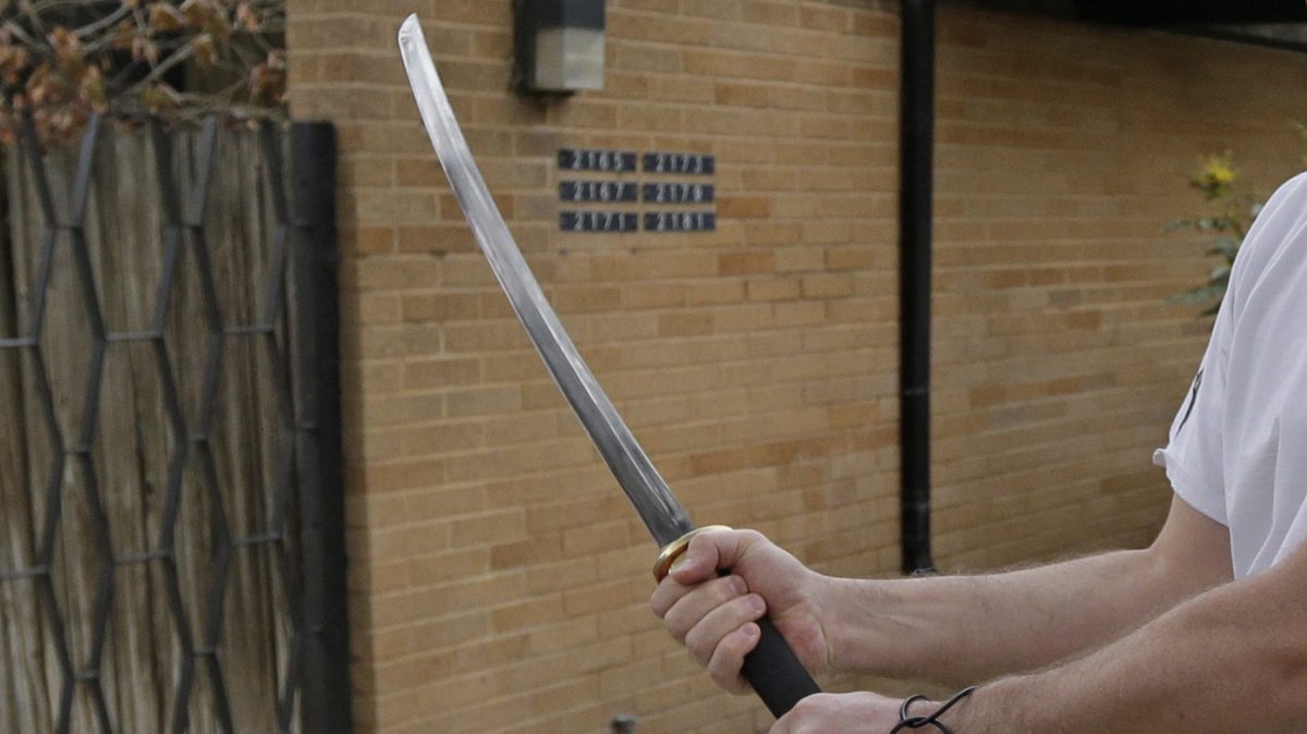 Police later seized a two-foot sword, a knife with a 12-inch blade and a four-inch folding knife. .