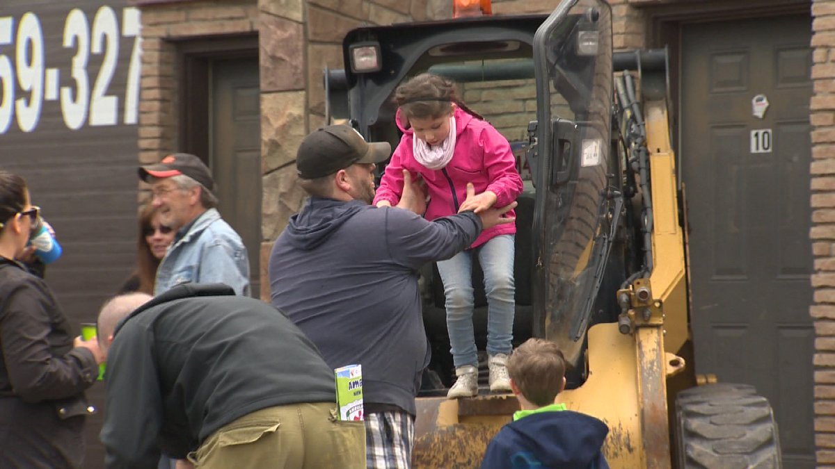 Kids check out heavy duty vehicles at Touch A Truck in Hanwell, New Brunswick.