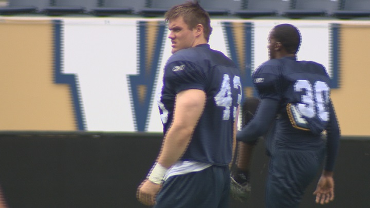 Winnipeg Blue Bombers draft pick Trent Corney stretches on the opening day of rookie camp.