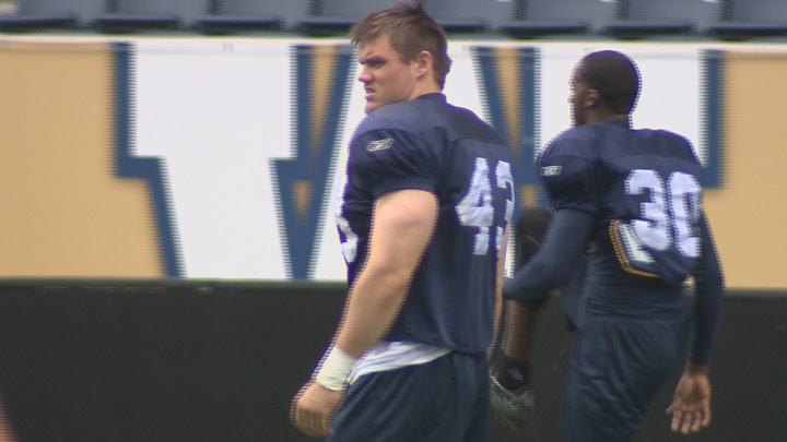 Winnipeg Blue Bombers draft pick Trent Corney stretches on the opening day of rookie camp.