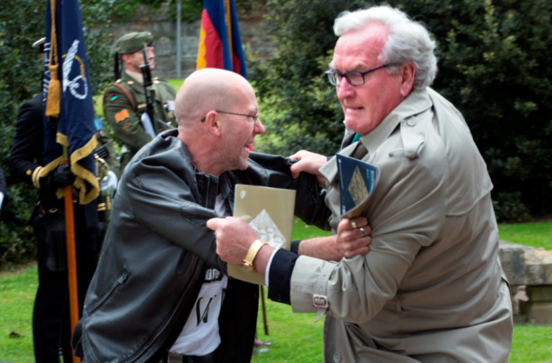 A protester is tackled by the Canadian Ambassador to Ireland, Kevin Vickers at an event marking the deaths of British Soldiers. 