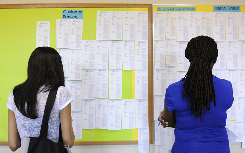 Zohra Surani,21, left and Melinda Cuffy, 23, pore over jobs listings at the Summer Jobs Services centre in downtown Toronto. 
