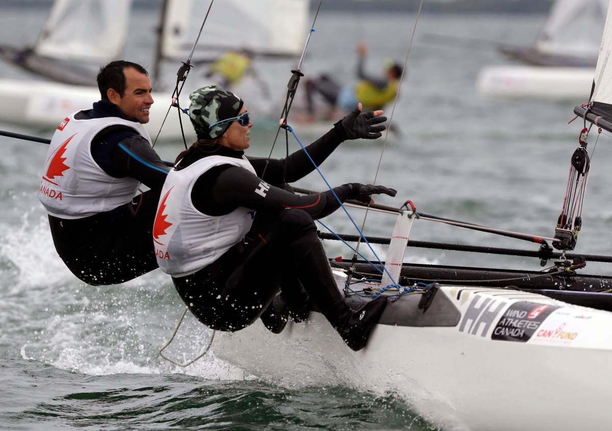 Canada’s sailing team Luke Ramsay, left, and Nikola Girke, right, compete in the Nacra 17 class during the ISAF Sailing World Cup Miami, Friday, Jan. 29, 2016, in Miami.