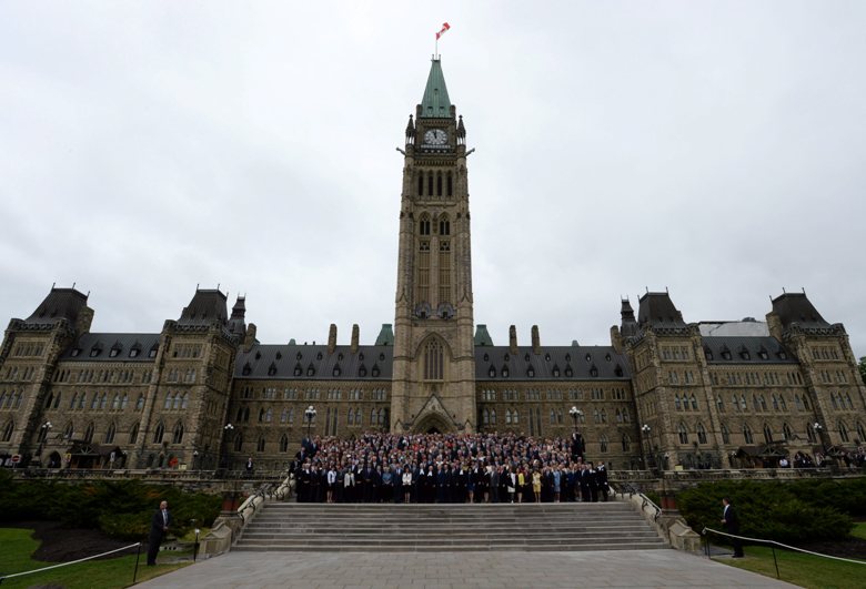 Parliamentarians on the front steps of Parliament Hill for a photo to mark the 150th anniversary of parliament Wednesday June 8, 2016 in Ottawa. 