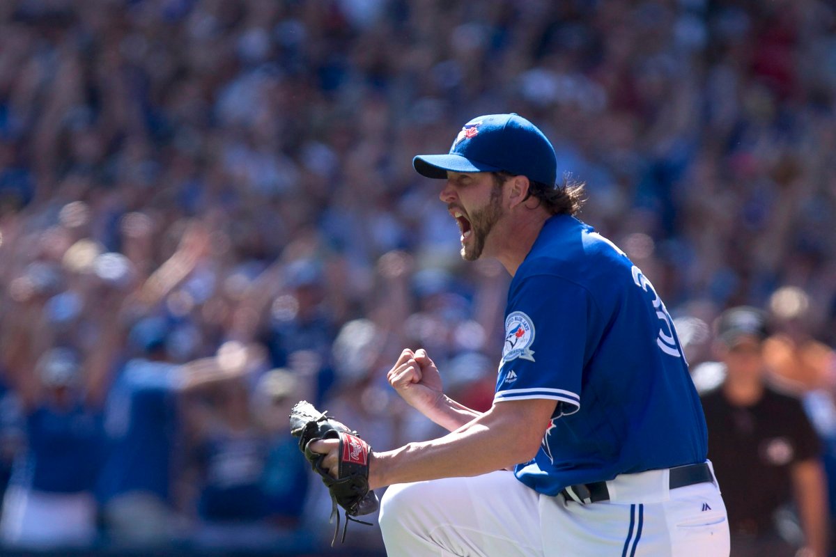 Toronto Blue Jays relief pitcher Jason Grilli celebrates after striking out Baltimore Orioles Jonathan Schoop to close the ninth inning and give the Jays a 10-9 win in American League baseball action in Toronto on Sunday, June 12 , 2016. 
