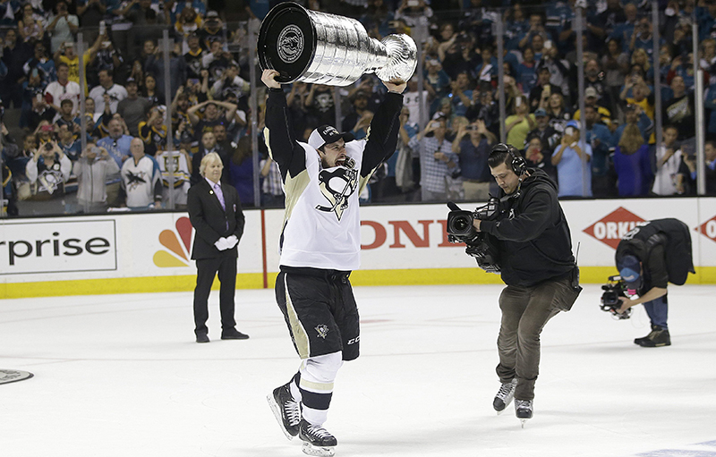 Pittsburgh Penguins center Sidney Crosby celebrates with the Stanley Cup after Game 6 of the NHL hockey Stanley Cup Finals against the San Jose Sharks in San Jose, Calif., Sunday, June 12, 2016. The Penguins won 3-1 to win the series 4-2. 