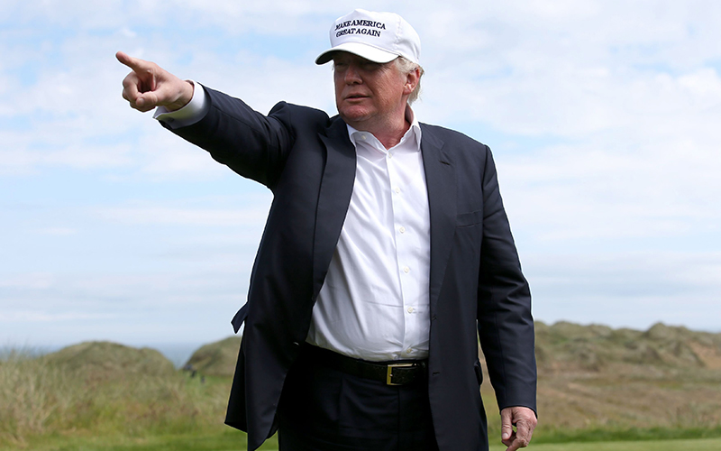 US presidential candidate Donald Trump points as he chats with the media after he arrived at the Trump International Golf Links at Balmedie, near Aberdeen, Scotland, Saturday June 25, 2016.  