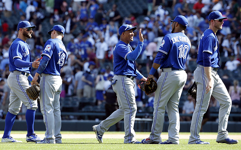 Toronto Blue Jays players celebrate after they defeated the Chicago White Sox 10-8 in a baseball game in Chicago, Saturday, June 25, 2016. 