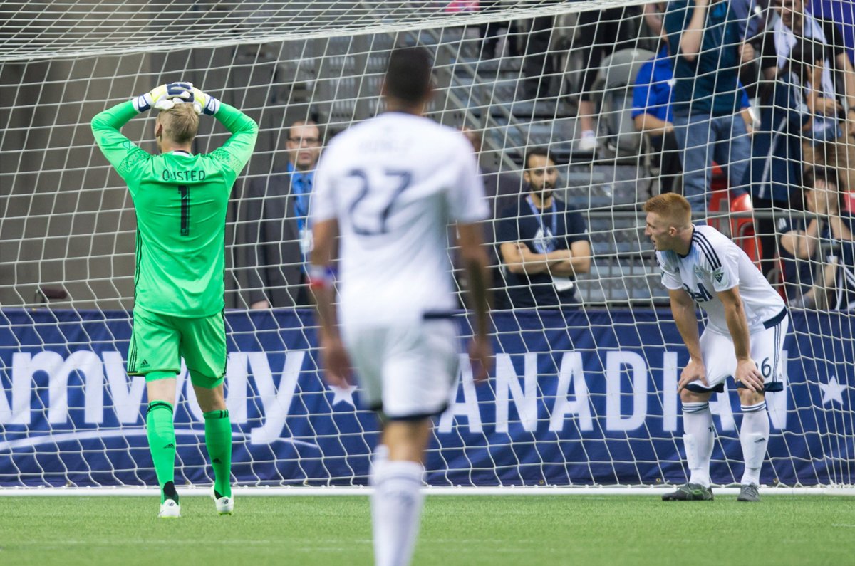 Vancouver Whitecaps' goalkeeper David Ousted, from left, Blas Perez and Tim Parker look on after Toronto FC's Will Johnson, not seen, scored in the final moments during second half Canadian Championship final soccer action to win the Voyageurs Cup on aggregate in Vancouver, B.C., on Wednesday June 29, 2016. 