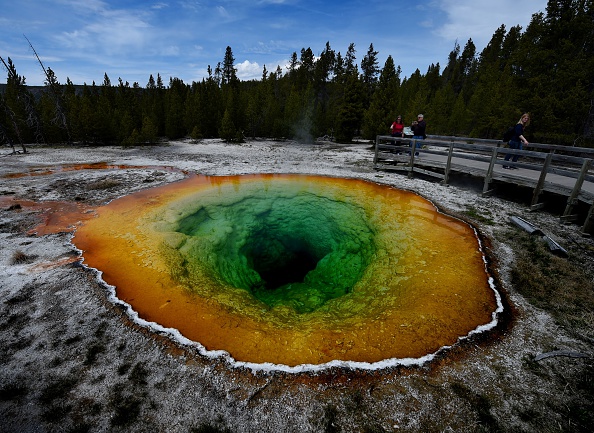 Tourists view the Morning Glory hot spring in the Upper Geyser Basin of Yellowstone National Park in Wyoming, on May 14, 2016. 