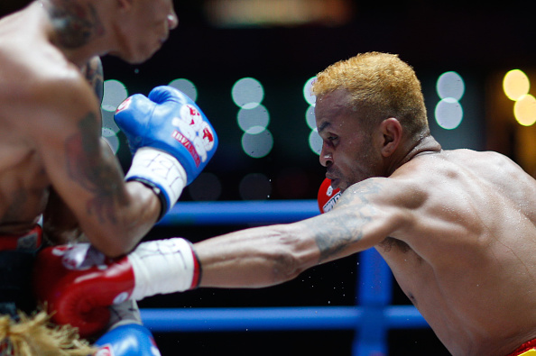 Amnat Ruenroeng (R) of Thailand punches John riel Casimero of Philippines during the IBF World Boxing Championship at Beijing Olympic park diamond stadium on May 25, 2016 in Beijing, China.  (Photo by VCG/VCG via Getty Images).