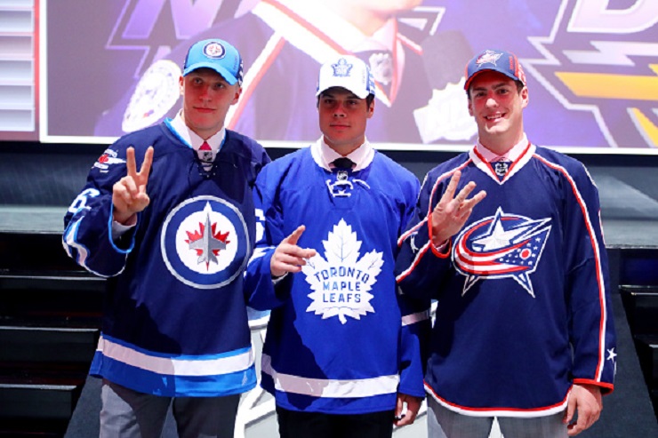 The players flanking 2016 first overall pick Auston Matthews are swapping jerseys — Laine was selected by the Winnipeg Jets second overall, and Dubois followed one pick later, going to Columbus.