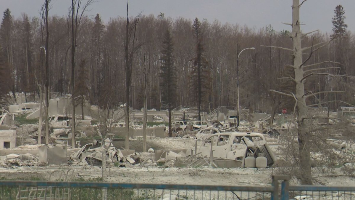 Restricted areas are fenced off in Fort McMurray but residents have been allowed to return for supervised visits.