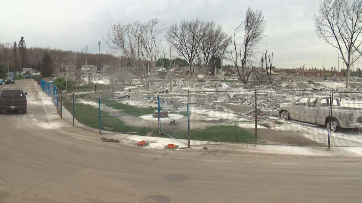Security vehicles and those of residents were seen driving around the Abasand neighbourhood in Fort McMurray Wednesday.