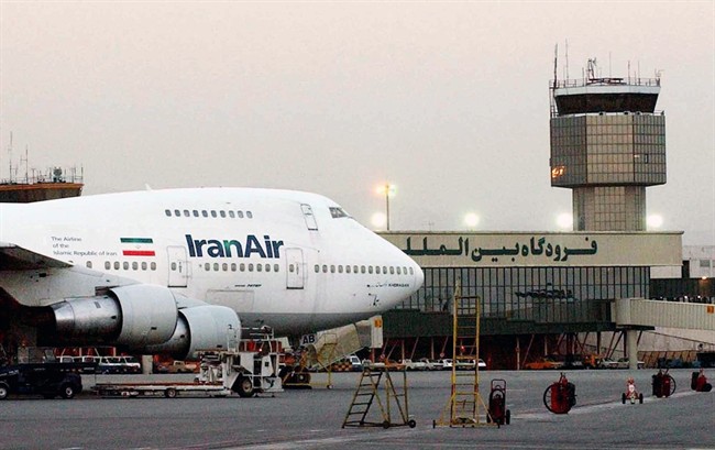 FILE - In this June 2003 file photo, a Boeing 747 of Iran's national airline is seen at Mehrabad International Airport in Tehran. Boeing Co. has confirmed signing an agreement with Iran Air‚ expressing the airline's intent‚ to buy its aircraft. In a statement Tuesday to The Associated Press, Boeing said it signed the agreement‚ under authorizations from the U.S. government following a determination that Iran had met its obligations under the nuclear accord reached last summer.(AP Photo/Hasan Sarbakhshian, File).