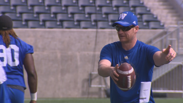 Winnipeg Blue Bombers head coach Mike O'Shea runs a drill during practice.