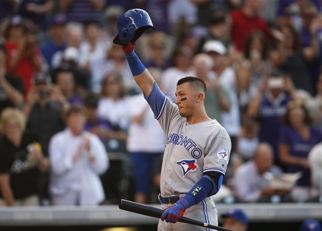 Toronto Blue Jays' Troy Tulowitzki acknowledges the ovation form the crowd as he steps into the batter's box against the Colorado Rockies in the second inning of a baseball game Monday, June 27, 2016, in Denver. Tulowitzki was making his first appearance in Denver since being traded by the Rockies to Toronto last July.