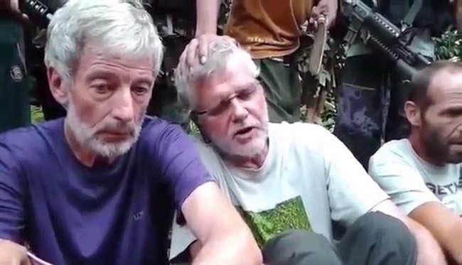 Canadians Robert Hall, left, and John Ridsdel are seen in this still image taken from an undated militant video. 