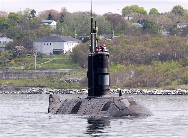 HMCS Windsor, one of Canada's four Victoria-class submarines, heads out the harbour in Halifax on Thursday, May 26, 2016.