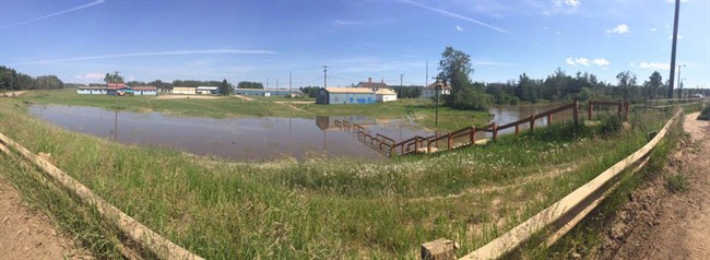 Flooding is shown on the Dene Tha' First Nation in northern Alberta in this recent handout photo. Up to 140 people have been forced from their homes due to flooding on a First Nation in northwestern Alberta. Chief Joe Pastion of the Dene Tha' First Nation says the community has declared a state of emergency.