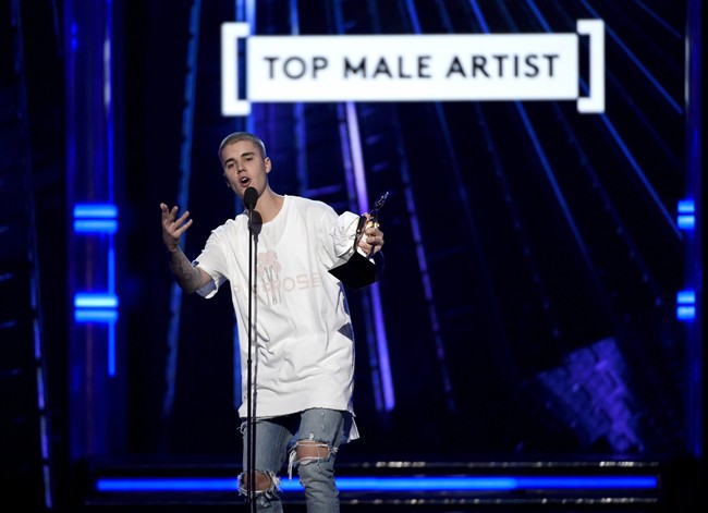 Justin Bieber accepts the award for top male artist at the Billboard Music Awards at the T-Mobile Arena on Sunday, May 22, 2016, in Las Vegas. 