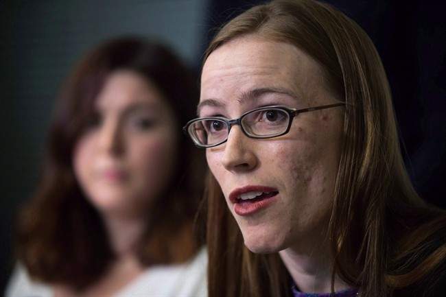 Former University of British Columbia students Glynnis Kirchmeier and Caitlin Cunningham, back, hold a news conference at the university in Vancouver, B.C., on Sunday, November 22, 2015.