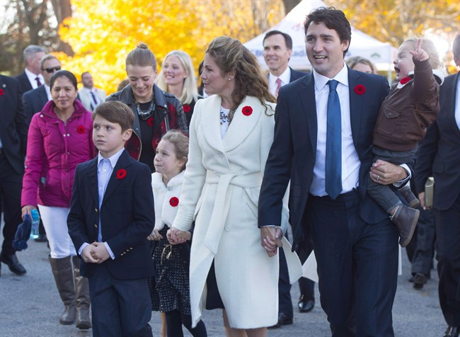 Marylou Trayvilla, one of two women employed to take care of the Trudeau children, is seen at left as she joins prime minister-designate Justin Trudeau and family upon their arrival to Rideau Hall for the swearing-in ceremony in Ottawa on Wednesday, November 4, 2015. Trayvilla will no longer be employed by the family come July 1.