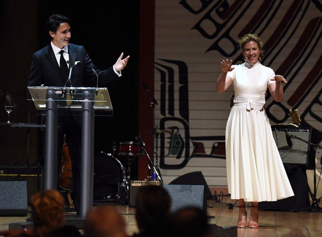 Prime Minister Justin Trudeau and his wife Sophie Gregoire Trudeau joke on stage during the annual Press Gallery Dinner at the Canadian Museum of History on Saturday, June 4, 2016 in Gatineau.