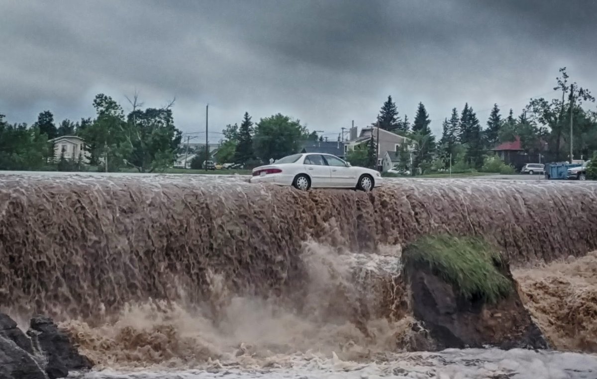 A photo of the car that was  stuck in flood waters on 8th Street in Dawson Creek on June 16, 2016.  