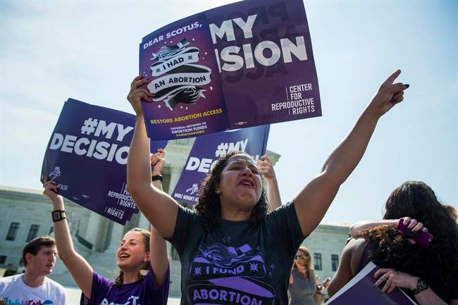 Renee Bracey Sherman of Chicago, Ill. celebrates at the Supreme Court in Washington, Monday, June 27, 2016, after the court struck down Texas' widely replicated regulation of abortion clinics.
