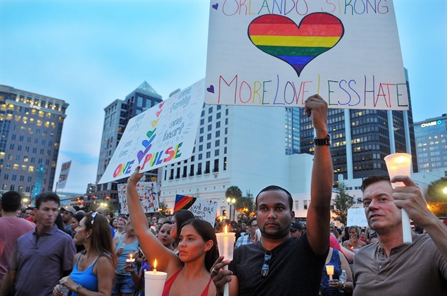 Jennifer Lopez, Britney Spears and Selena Gomez are among stars who have recorded the song 'Hands' to raise funds for victims of the Orlando shooting. Above, a memorial for victims held in Orlando on Monday, June 13, 2016.